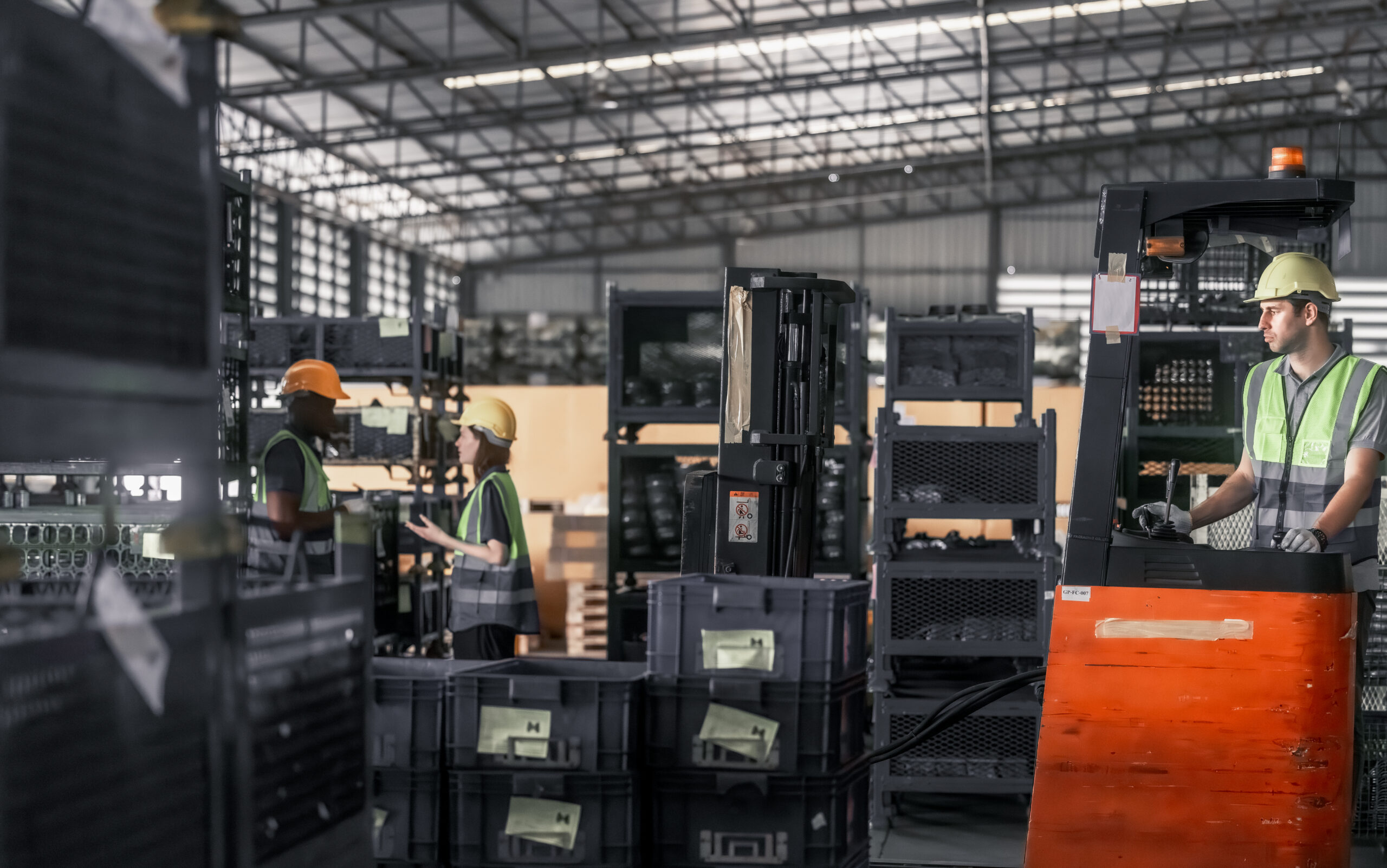Warehouse forklift operator moving and storing merchandise