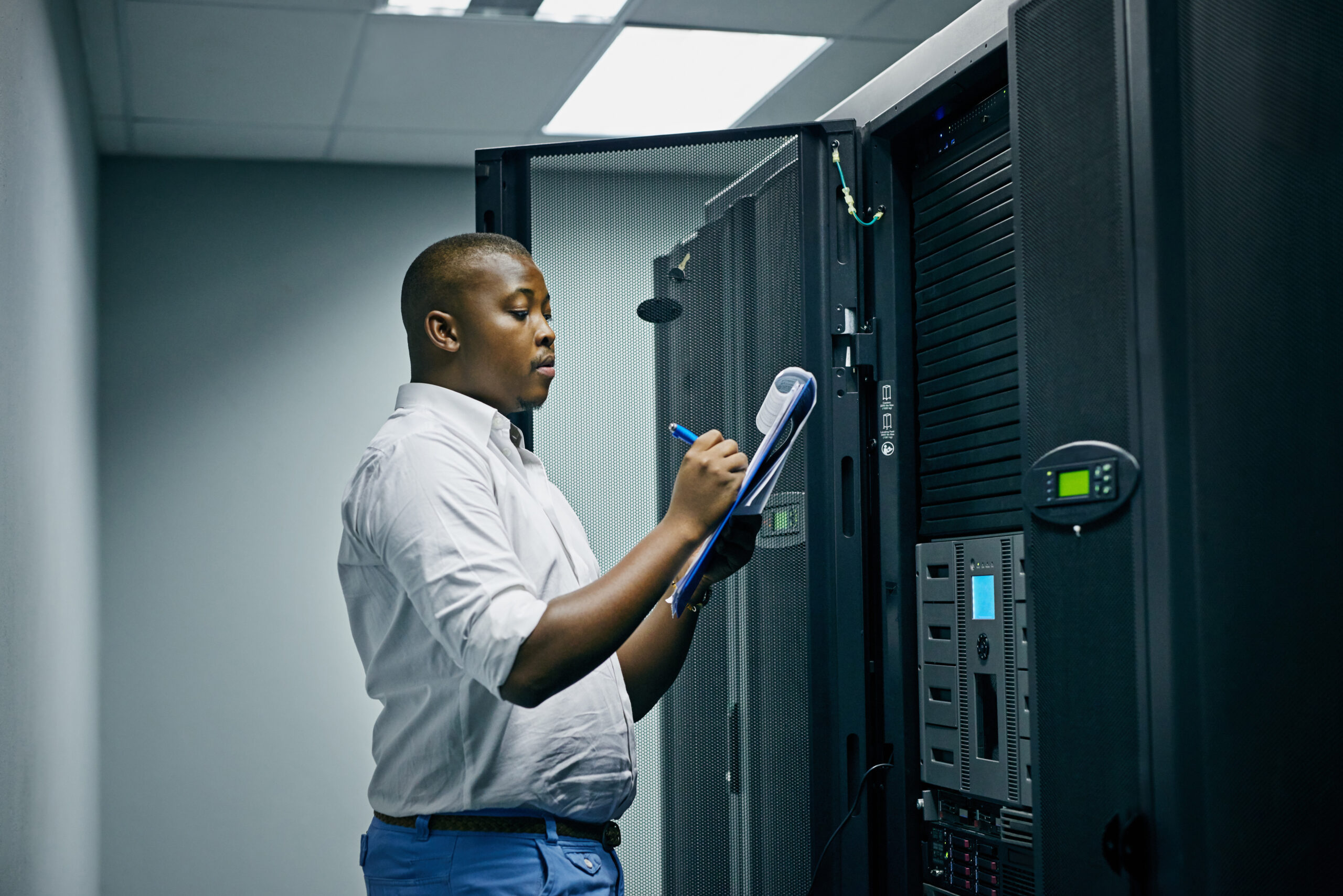 IT technician doing inspections in a data center